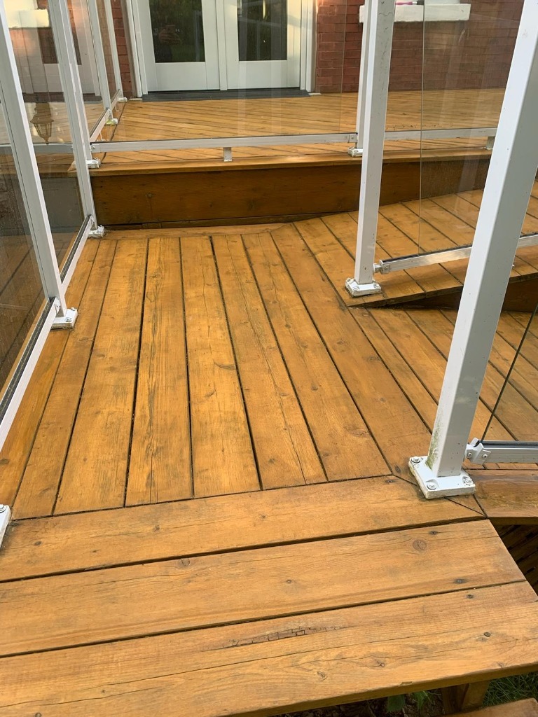 Restored and freshly stained deck on a London Ontario home after professional deck restoration by Core Exteriors