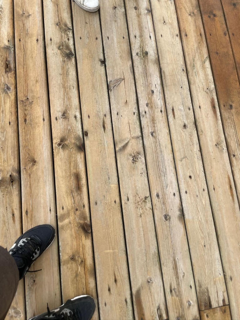 Deck boards sanded and prepped for staining during professional deck restoration in London Ontario