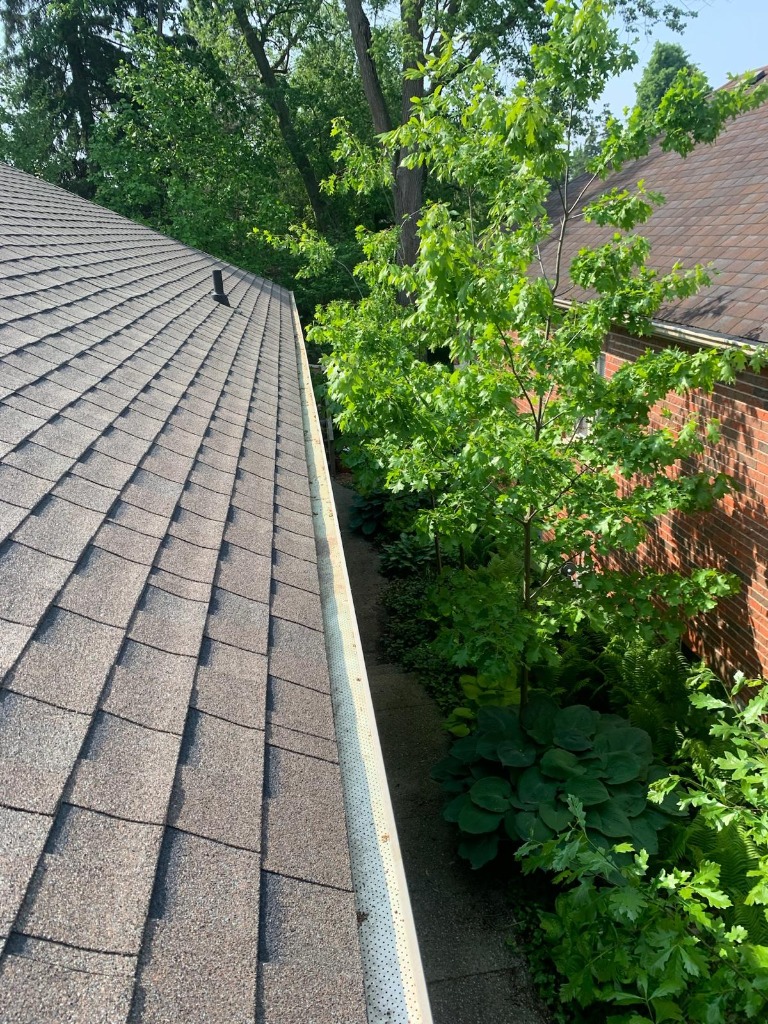 Clear flowing eavestrough on a London Ontario home after professional gutter cleaning by Core Exteriors