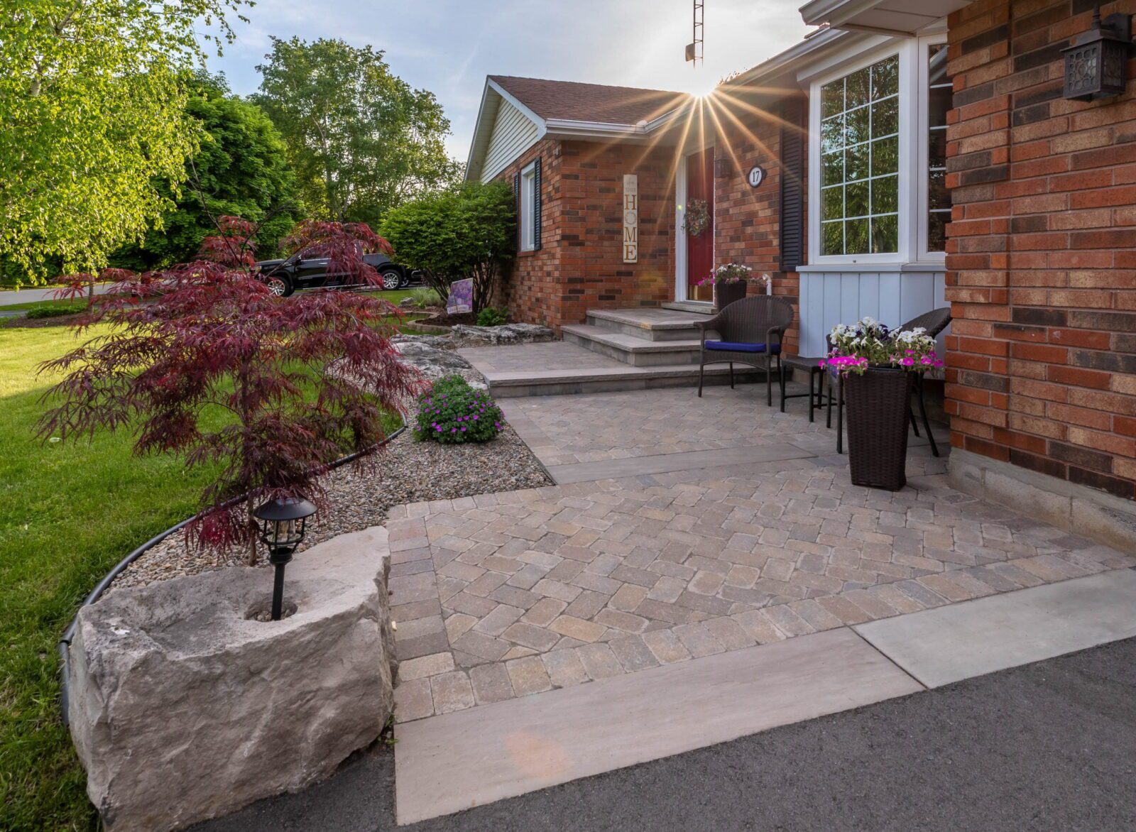 Newly installed interlock paver front walkway and driveway at a brick home in Masonville London Ontario