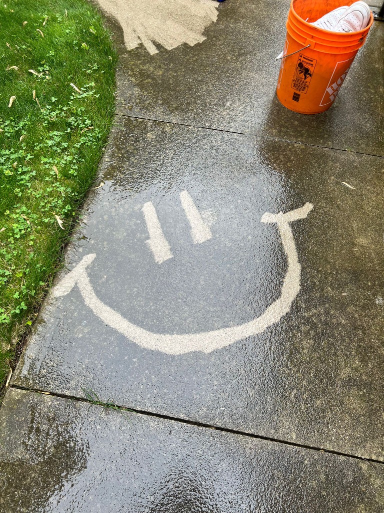 Clean concrete sidewalk in Byron London Ontario after professional pressure washing by Core Exteriors